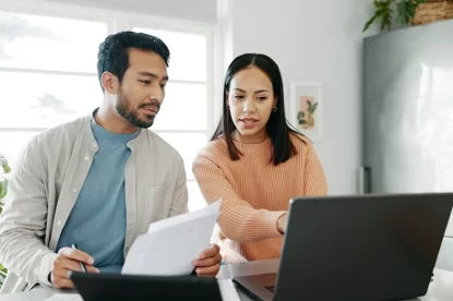 Married people conversation and budget for insurance policy investing or tax returns in apartment or family hom